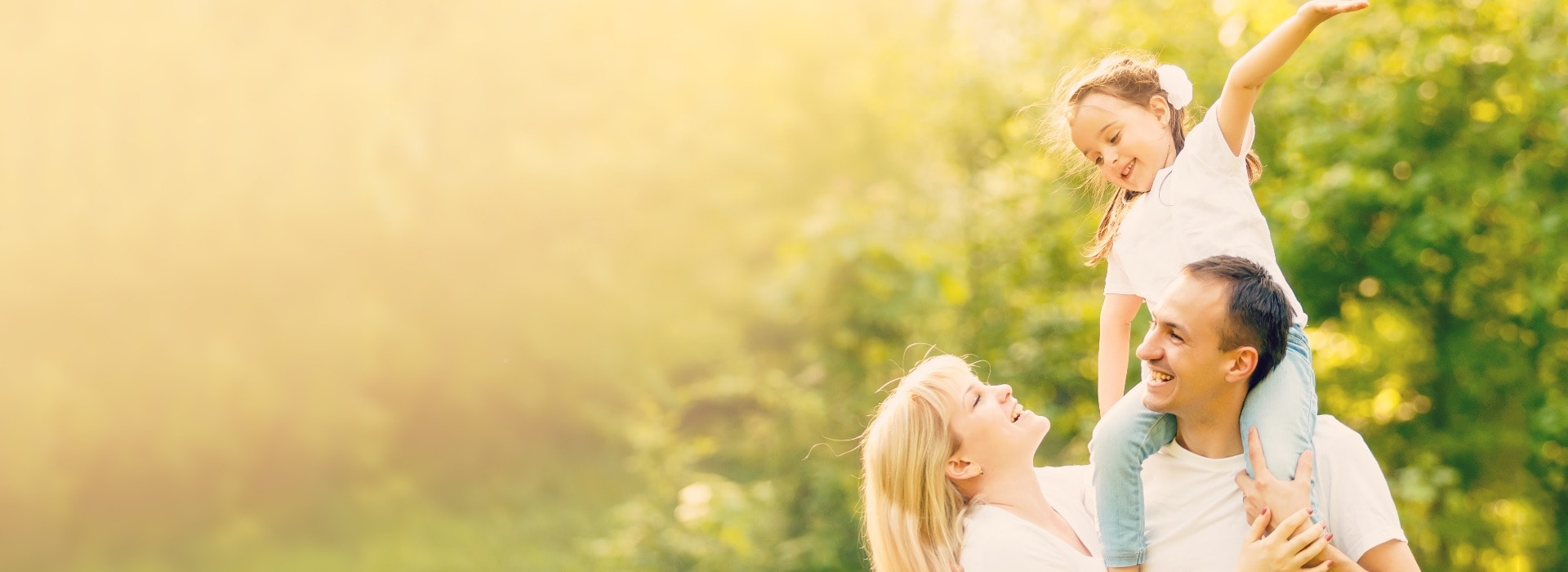 Happy family: mother father and child daughter on nature on sunset